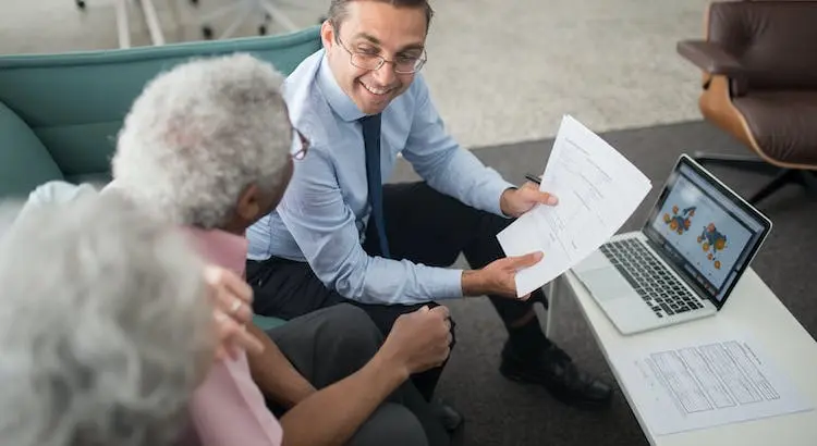 agent-showing-documents-to-an-elderly-man