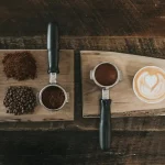 cup-of-coffee-beans-on-a-wooden-board