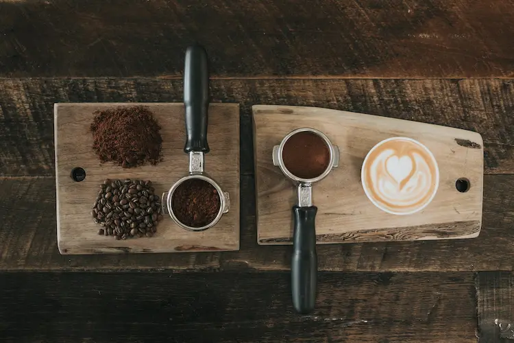 cup-of-coffee-beans-on-a-wooden-board